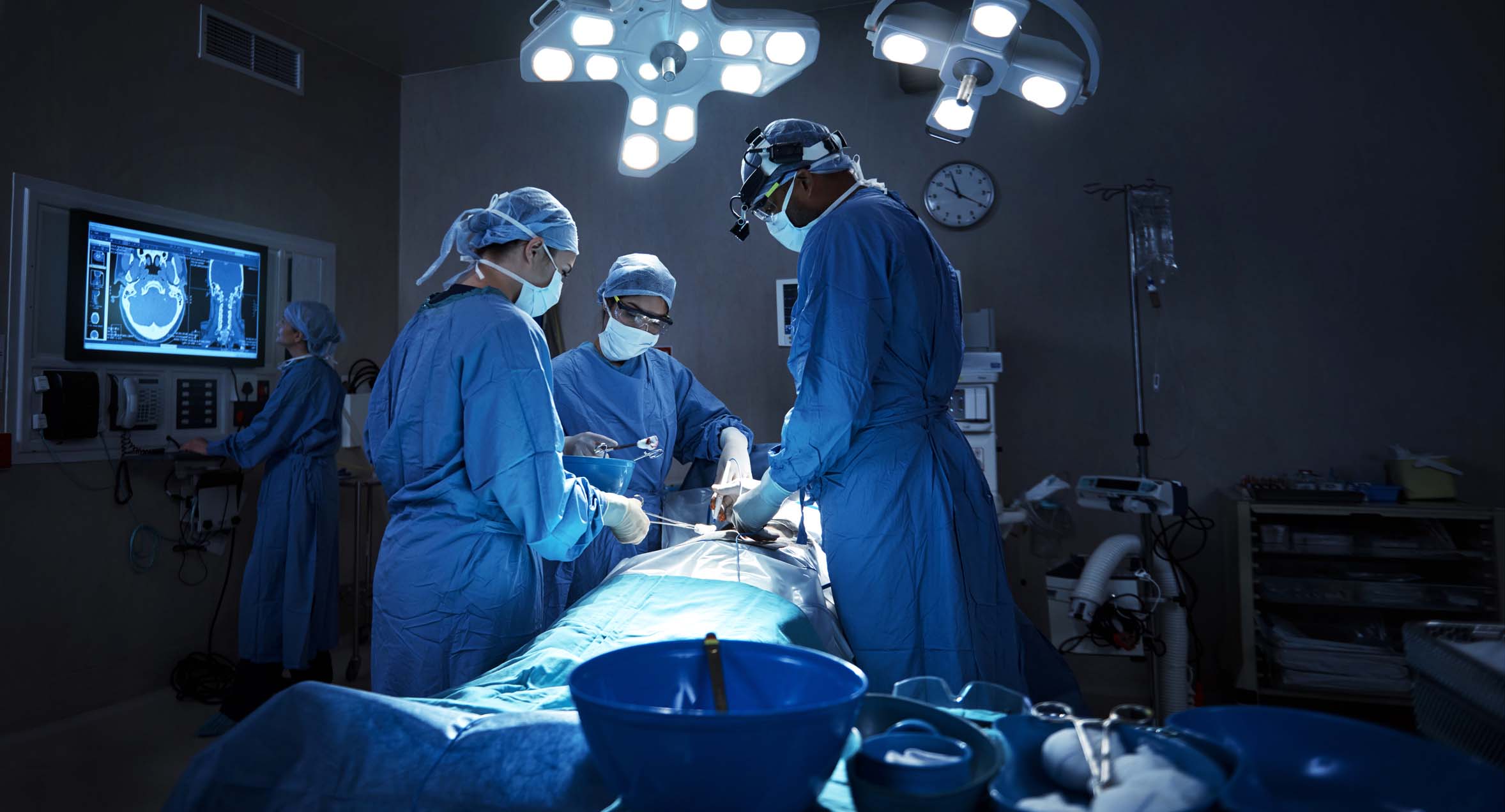 surgeons performing a surgery in an operating room